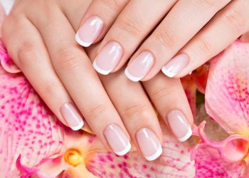 Beautiful woman's nails with beautiful french manicure