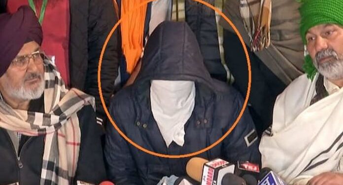 watch farmers at singhu border present masked man who alleged shootout plot to disrupt tractor rally on jan 26