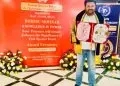 Dr Kishor Chandola receiving national award for Ayush and human service